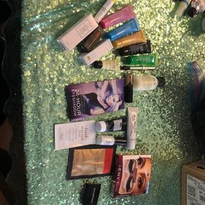 Random assortment of makeup and skincare samples.